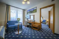 Room with beds and sofa