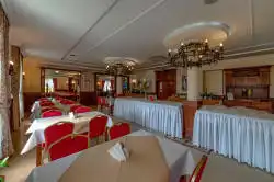 Spacious dining room with set tables
